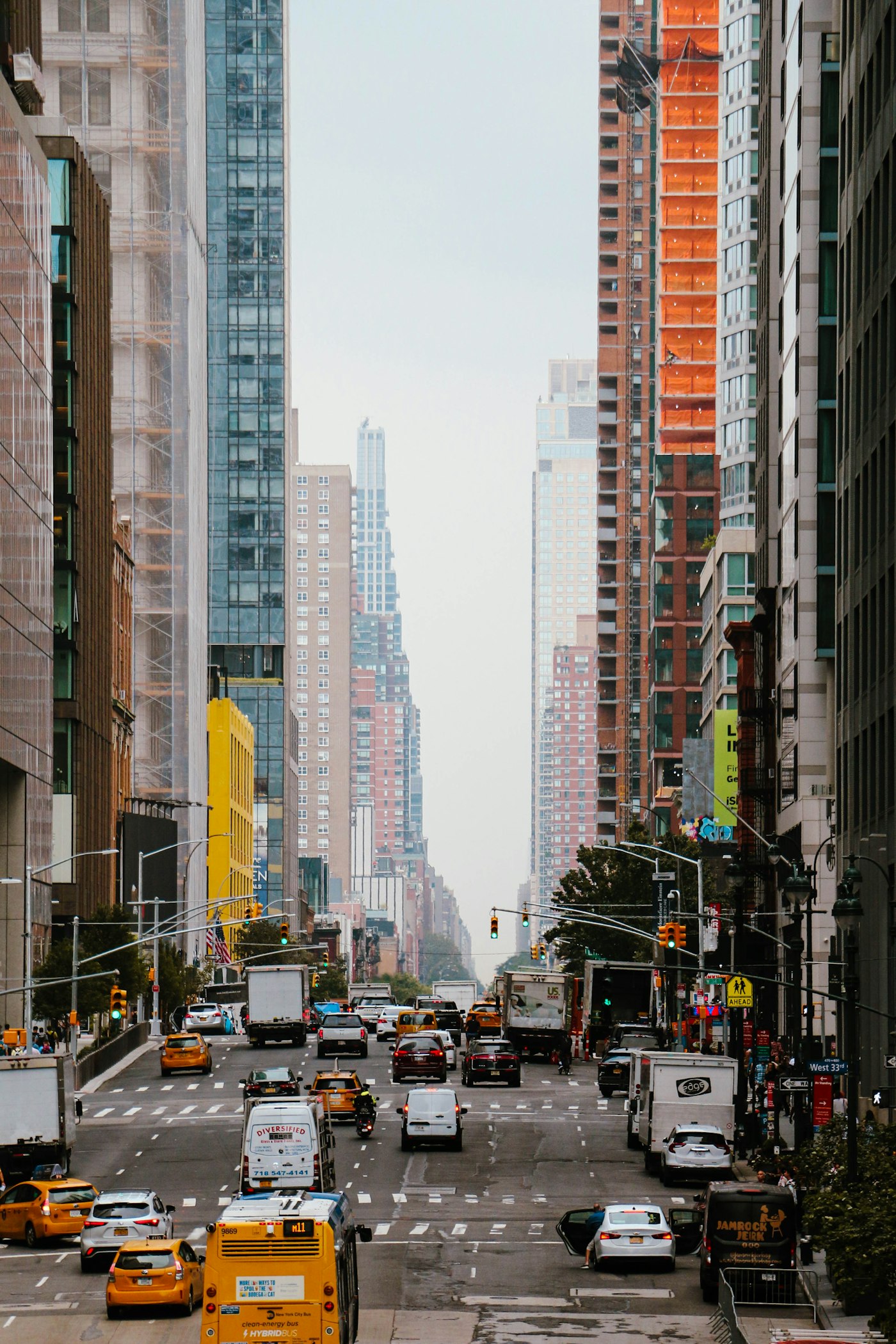 Taxis and other vehicles sharing a busy city street