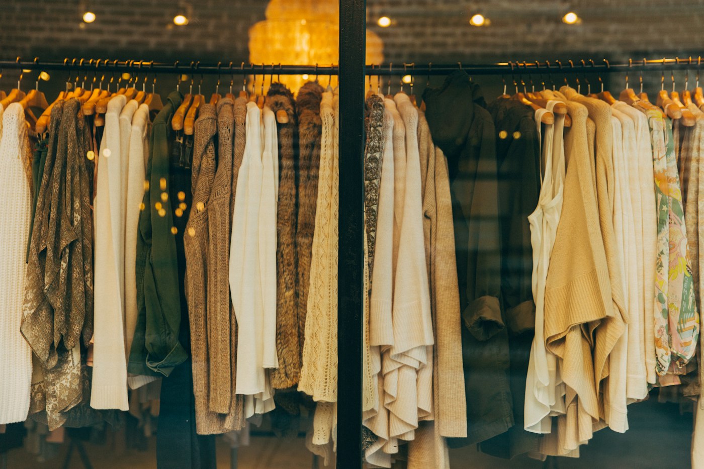 Clothing displayed on rails in a shop