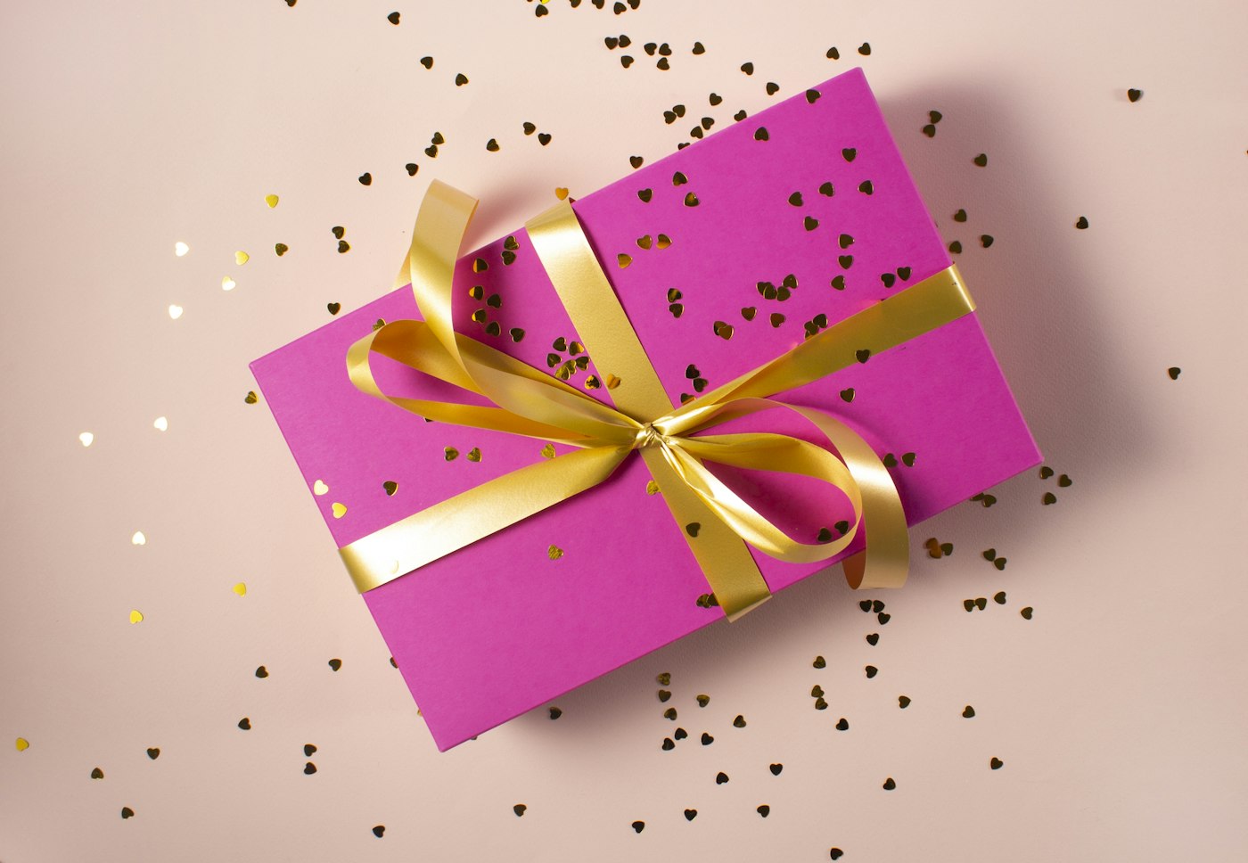 A small wrapped gift with a bright ribbon