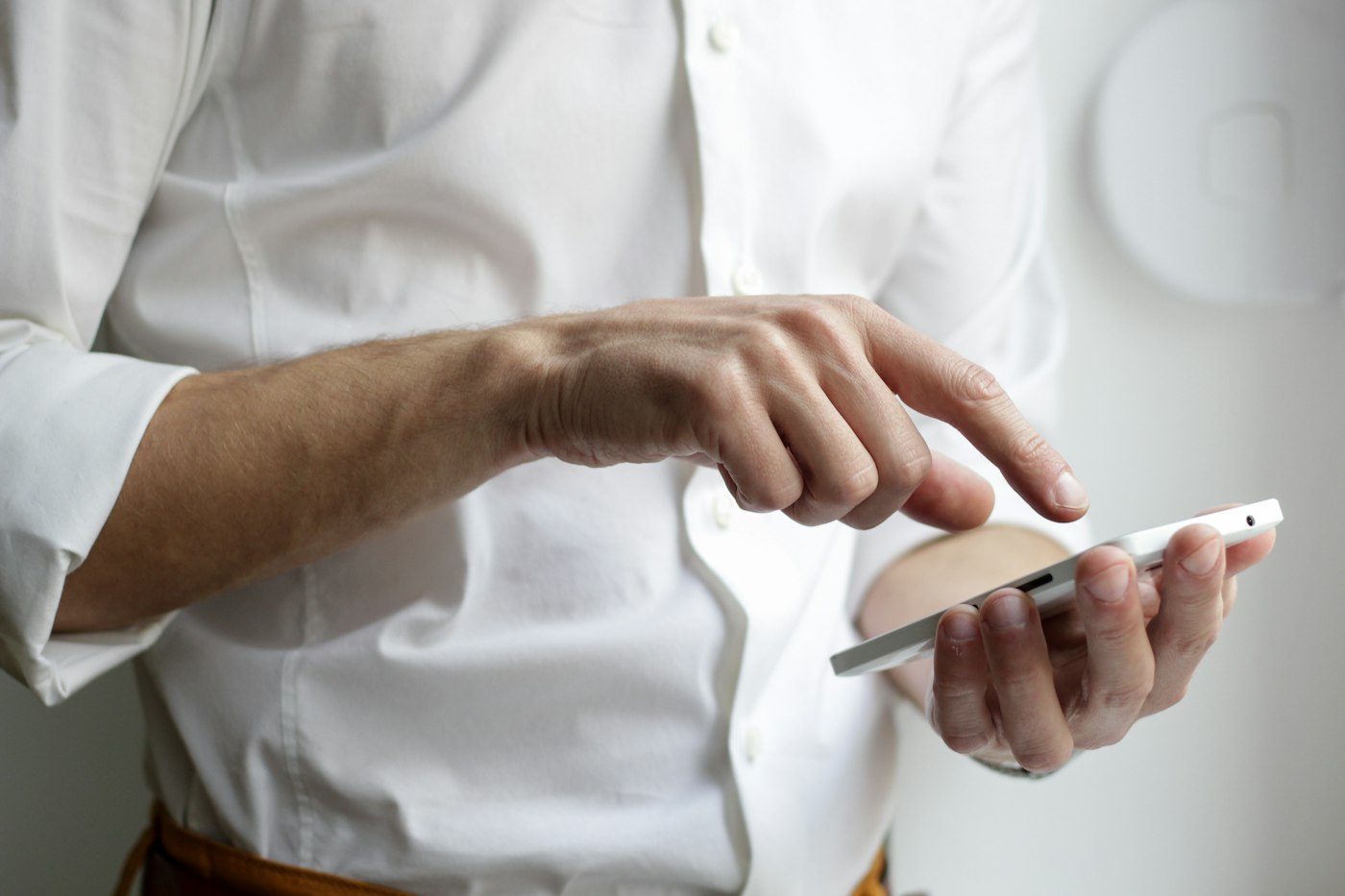 A person using a smartphone held in one hand