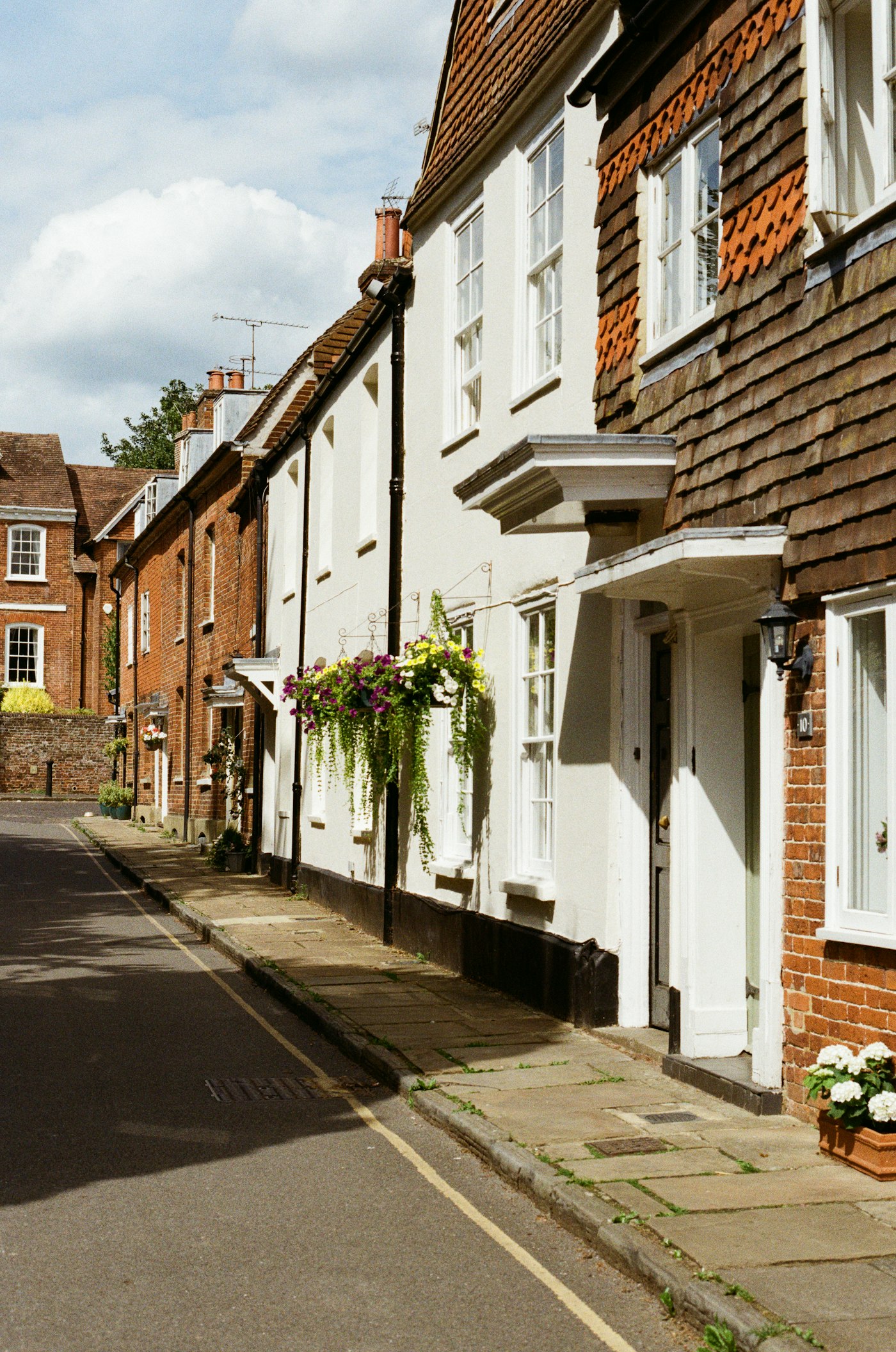 Homes and flower baskets along a neighborhood street