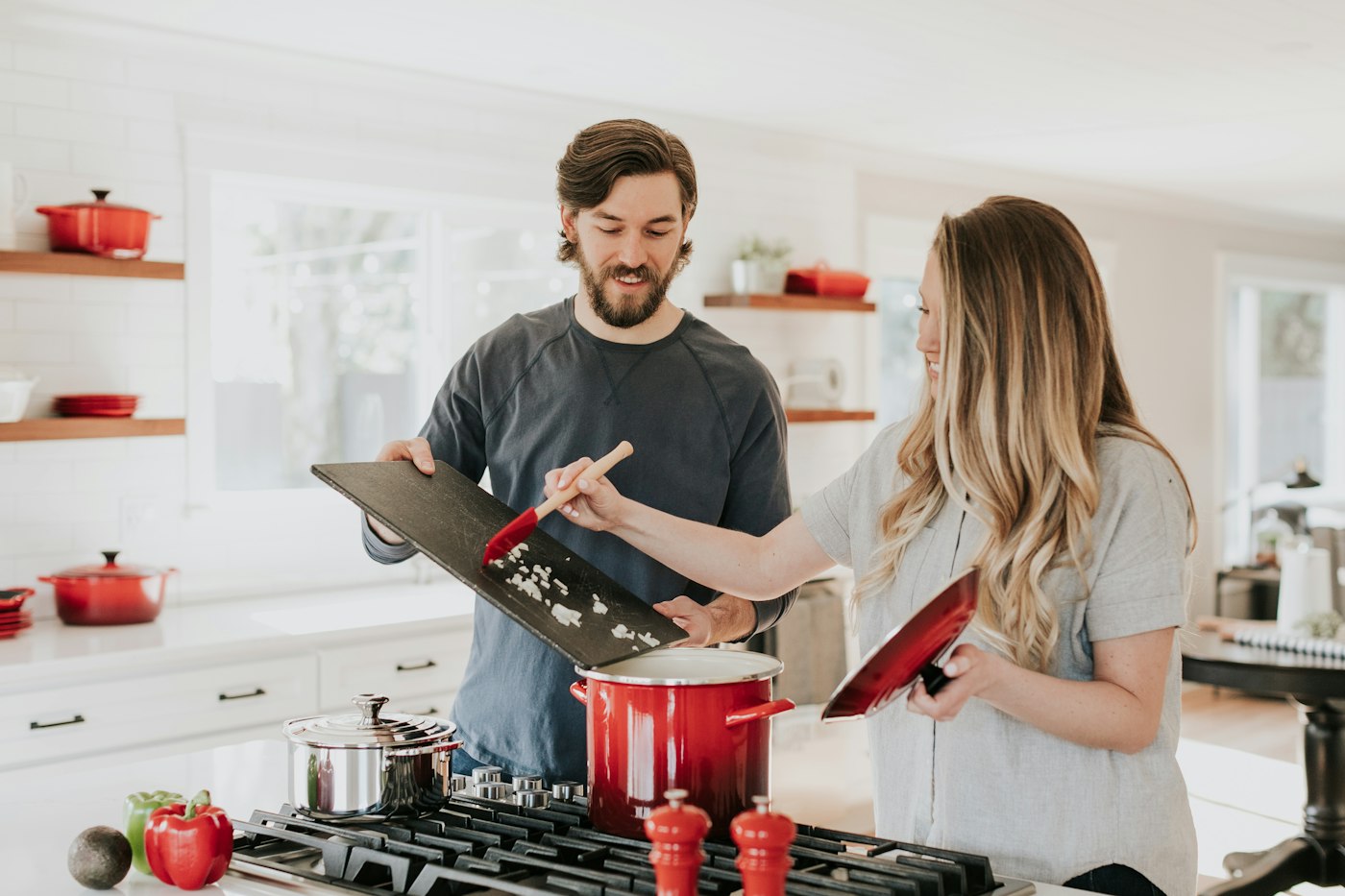 Two people preparing a meal together in a kitchen